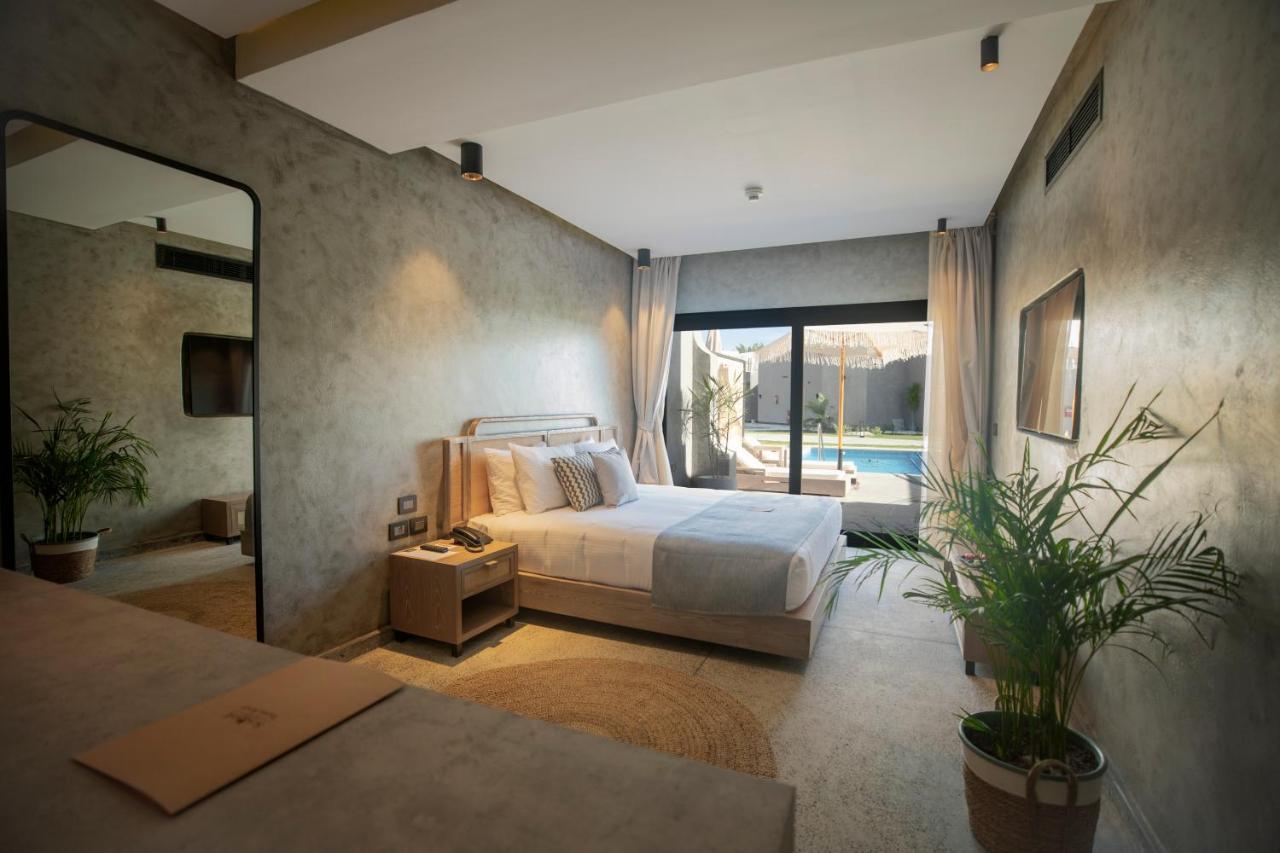 Sunrise Tucana Resort Grand Select Hurghada Exteriér fotografie A bedroom at the hotel