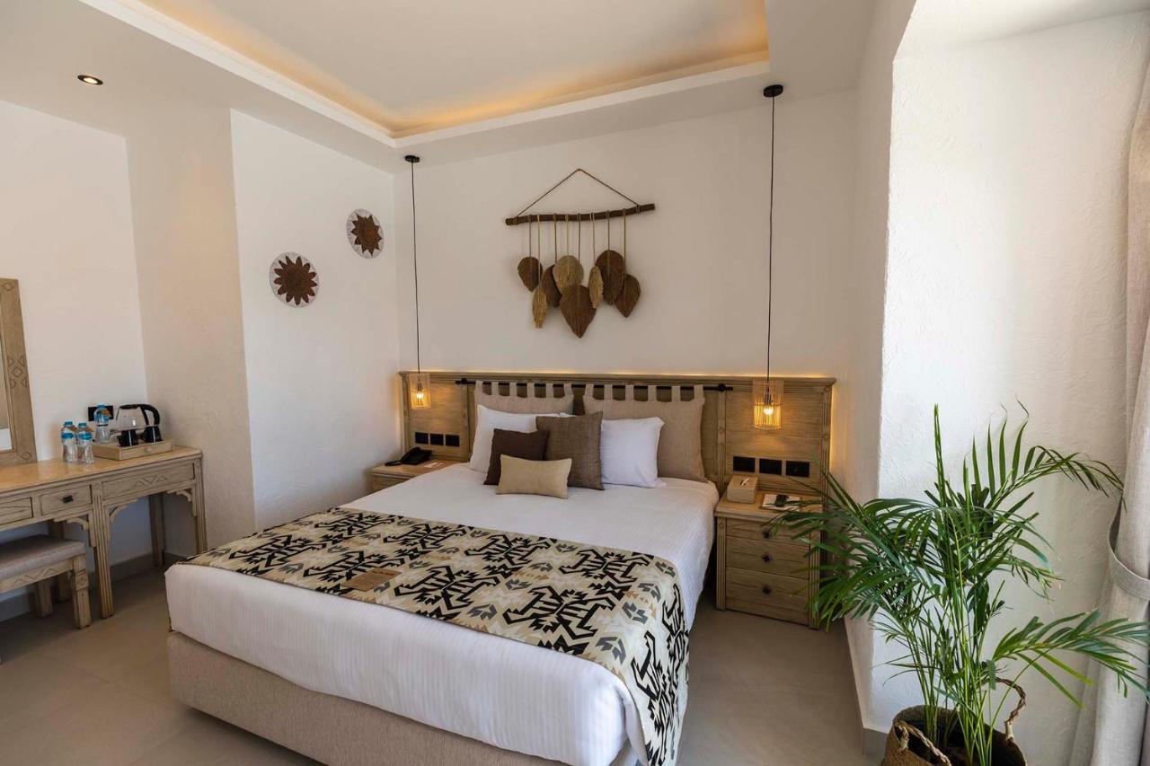 Sunrise Tucana Resort Grand Select Hurghada Exteriér fotografie A bedroom at the hotel